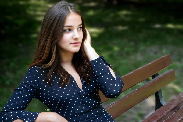 Emotional Girl Teenager Long Hair Hairstyle Braids Green Shirt Sits — Stock Photo, Image