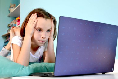 Girl student online learning class study online video call zoom teacher, Happy girl learn english language online with laptop at home. New normal. Social distancing. stay home . High quality photo
