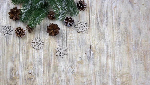 Christmas box of New Years toys on a wooden background. — Stock Photo, Image