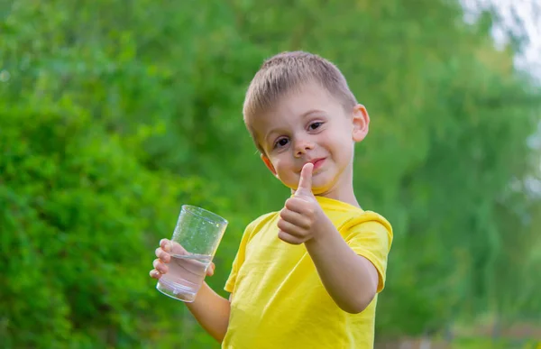 Boy Drinks Water Glass Pure Water Summer Selective Focus Royalty Free Stock Images