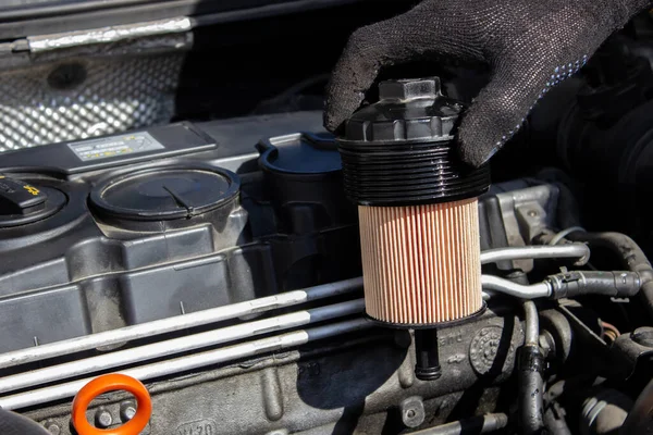 Car engine oil filter replacement. Transmission and maintenance. Energy fuel concept.