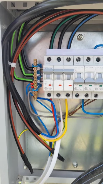 electricity distribution box with wires and circuit breakers (fuse box)