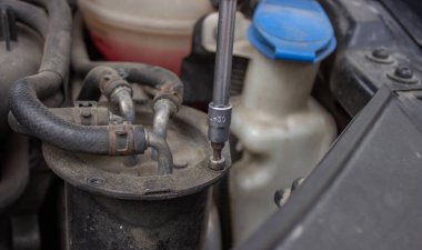 Car repair, filter replacement selective focus