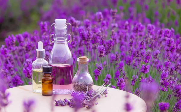 Bottle Lavender Essential Oil Wooden Table Field Flowers Background Selective — 图库照片