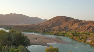 sunset over Kunene river at the border of Namibia and Angola, Africa