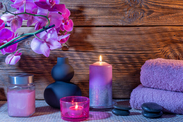 Spa, zen basalt stones, towels, candles in the massage room.