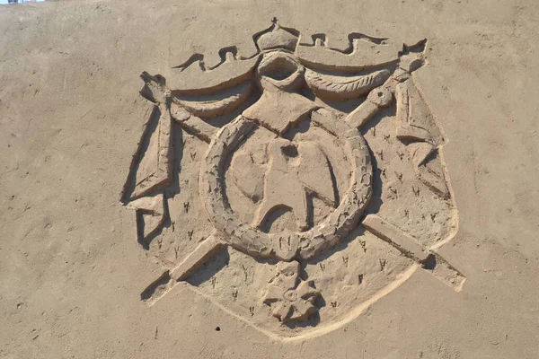 Sand sculpture of coat of arms of the roman empire