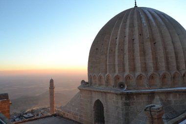 Sunset in Mardin Turkey with minaret of a building
