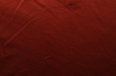 Kırmızı kumaş desenli arka plan. Alçak tuş.