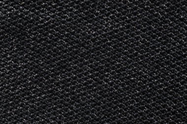 Kaba kumaşlı siyah bir arkaplan. Koyu, kaba arkaplan