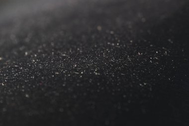 Plastik desenli siyah soyut bir arka plan. Seçici odak