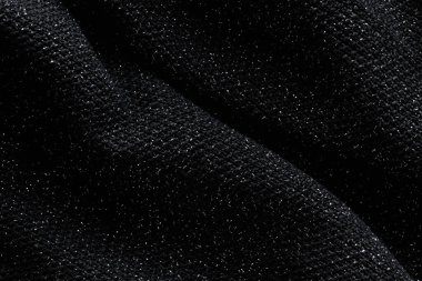 Siyah arka plan ve koyu dalgalı kumaş. Siyah kumaş deseni