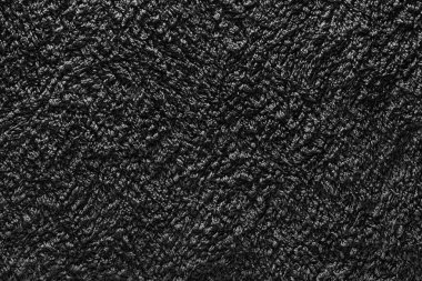 Koyu renkli gri kumaş dokusunun arka planı.