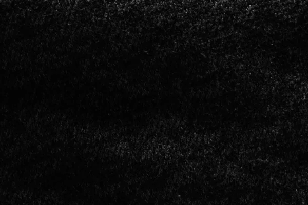 Karanlıktaki Siyah Kabarık Kumaş Dokunun Arka Planı — Stok fotoğraf