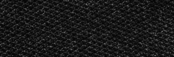 Black banner with rough fabric texture. Dark, rough background.