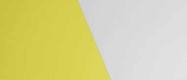 Yellow and white colored paper texture. Two color paper background