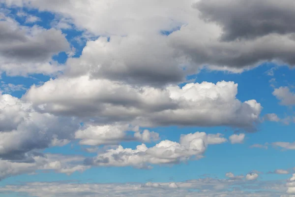 Clouds background. White clouds in a blue sky.