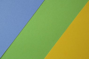 Tricolor blue, green and yellow textured paper background. Abstract background from craft paper.
