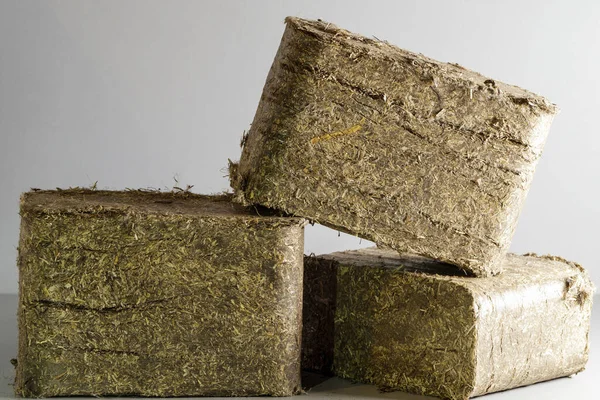 Briquettes. Solid fuel made from pressed flax. Ecological thermal energy from renewable resources.