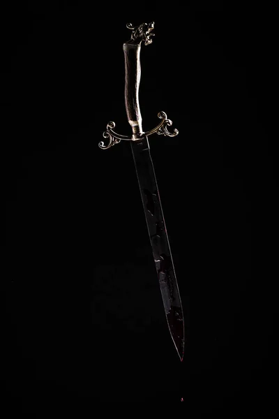 sword with a dagger on a black background
