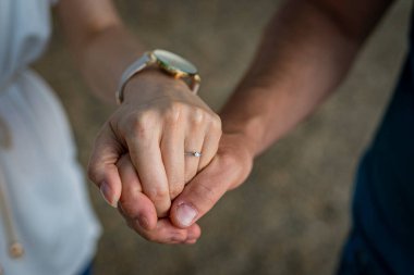 bride and groom hand