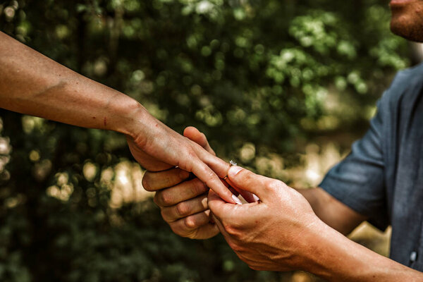 bride and groom hand