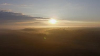 Morning Fog in the Rays of Sunrise. Aerial view.