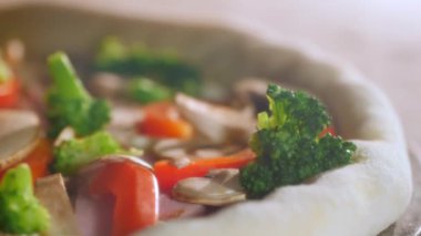 The process of cooking pizza in the oven. Close-up. Time lapse. Cheese is boiling, peppers, mushrooms, broccoli, ham, dough are baking. High temperature.
