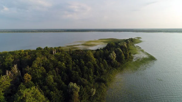 Flight over the island of Lake Svityaz. Volyn, Ukraine, Shatsk National Park.
