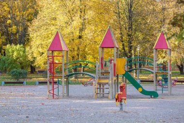 Children playground in the park. An empty children's playground is waiting for children.
