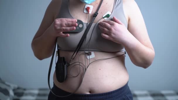 Woman Holter Monitor Device Daily Monitoring Electrocardiogram Female Wearing Holter — Stock Video