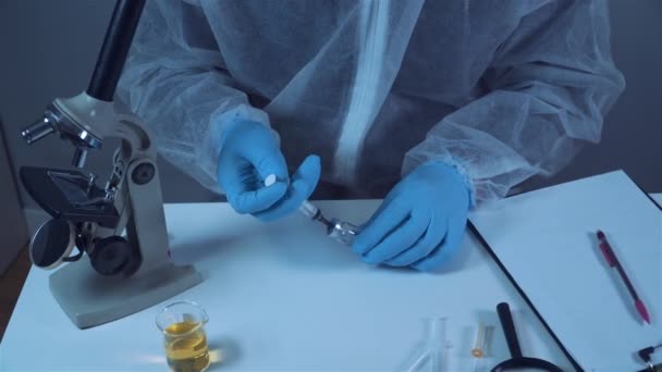 Lab Technician Protective Clothing Holds Vial Corona Virus Vaccine Takes — Αρχείο Βίντεο