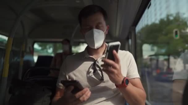 Man Sits Bus Wearing Protective Mask Ffp2 Uses Smartphone Germany — Stockvideo