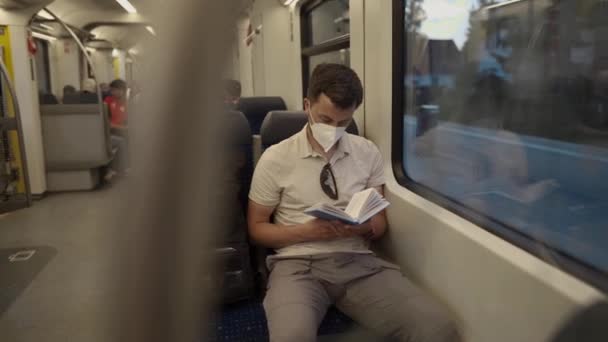 Passenger Public Transport Reading Book While Sitting Window Wearing Protective — Stock videók