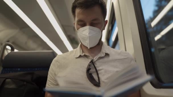 Male Passenger Mask Sits Passenger Seat Modern Train Germany Reads — Stok video