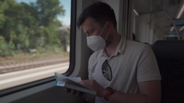 Passenger Public Transport Reading Book While Sitting Window Wearing Protective — 图库视频影像