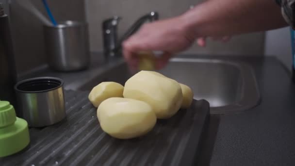 Man Peels Potatoes Special Vegetable Peeler Healthy Food Theme Male — стоковое видео