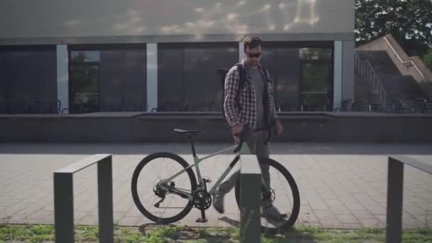 Cyclist Parks Locks Bicycle Public Bike Parking Lot Germany Safety — Stock Video