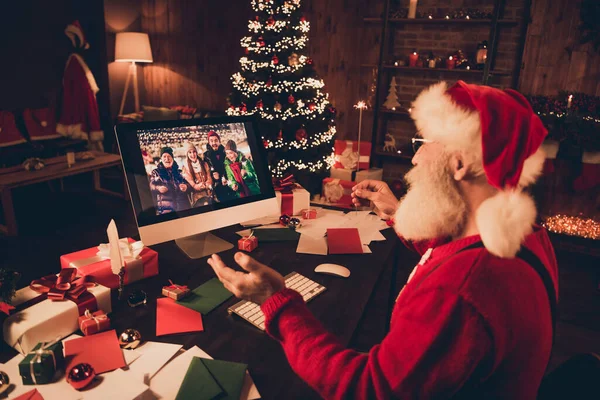 Back view photo portrait santa talking to friends congratulating with xmas holidays on webcam burning bengal lights on quarantine — ストック写真