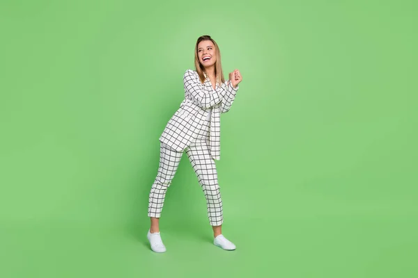 Full length body size view of attractive cheerful elegant chic lady dancing wearing formal suit having fun isolated over green color background — Stock Photo, Image