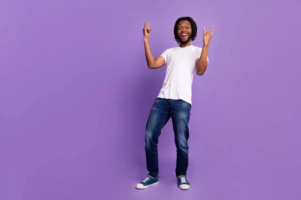 Full length body size view of attractive cheerful guy showing horn sign fooling isolated over bright violet purple color background — Stock Photo, Image