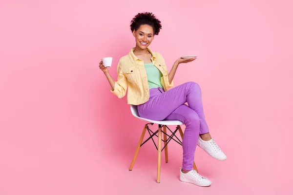 Full length photo of funny young brunette lady drink tea wear shirt trousers shoes isolated on pink background — Stock Photo, Image