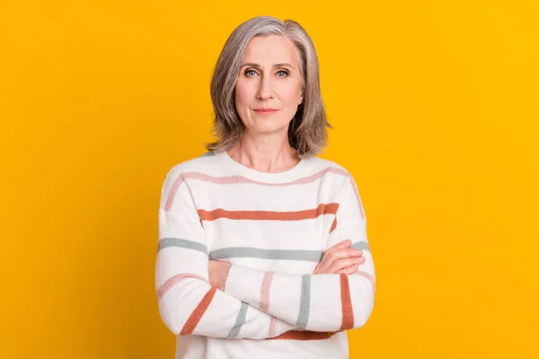 Portrait of attractive content serious grey-haired woman folded arms isolated over bright yellow color background — Stock Photo, Image