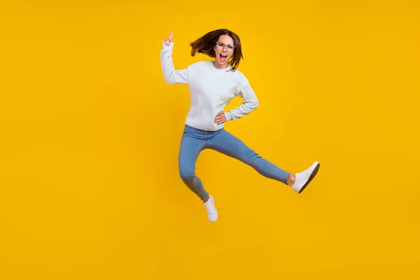 Full length photo of unhappy angry woman jump wear glasses finger warn isolated on yellow color background — Stock Photo, Image