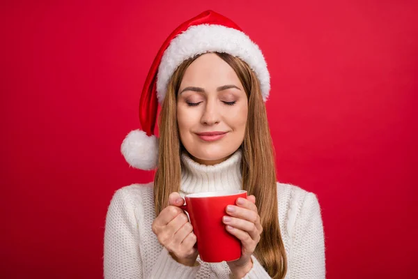 Portrait of attractive dreamy cheery woman drinking eggnog festal day time rest isolated over bright red color background — Stock Photo, Image