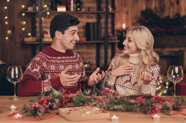 Photo of funky couple drink alcohol say wear red jumpers on new year indoors — Stock Photo, Image