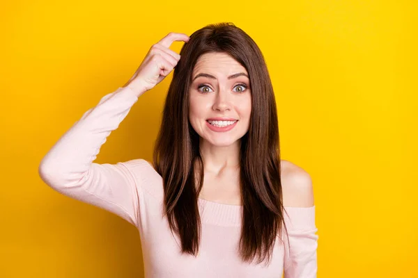Photo of optimistic brunette lady hand head wear pink shirt isolated on yellow color background — Stock Photo, Image