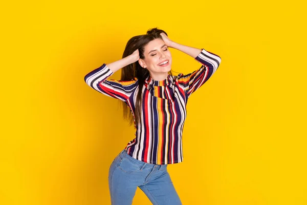 Photo portrait pretty girl wearing striped blouse dancing at party isolated vibrant yellow color background — Stock Photo, Image