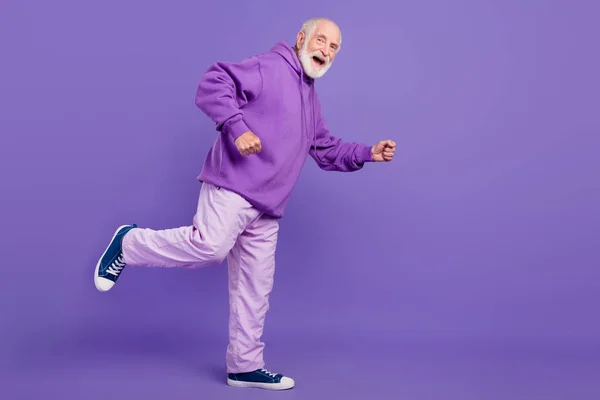 Full length body size view of nice cheerful grey-haired man dancing going having fun isolated over bright violet purple color background — Stock Photo, Image