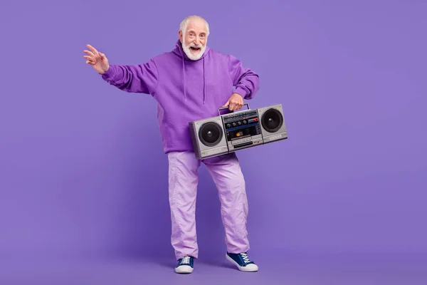 Full length body size view of trendy cheerful man holding boombox having fun isolated over bright violet purple color background — Stock Photo, Image